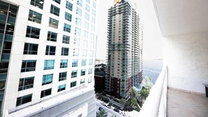 A high-rise building with multiple floors, large windows, and a view of the surrounding cityscape. - Stylish Brickell 1BR - Free Parking - Sleeps 6 (Miami)
