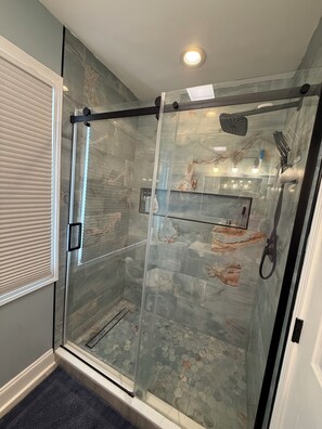 Shower, hair dryer, towels, soap