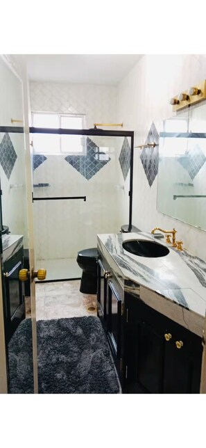 Shower, hair dryer, towels, soap