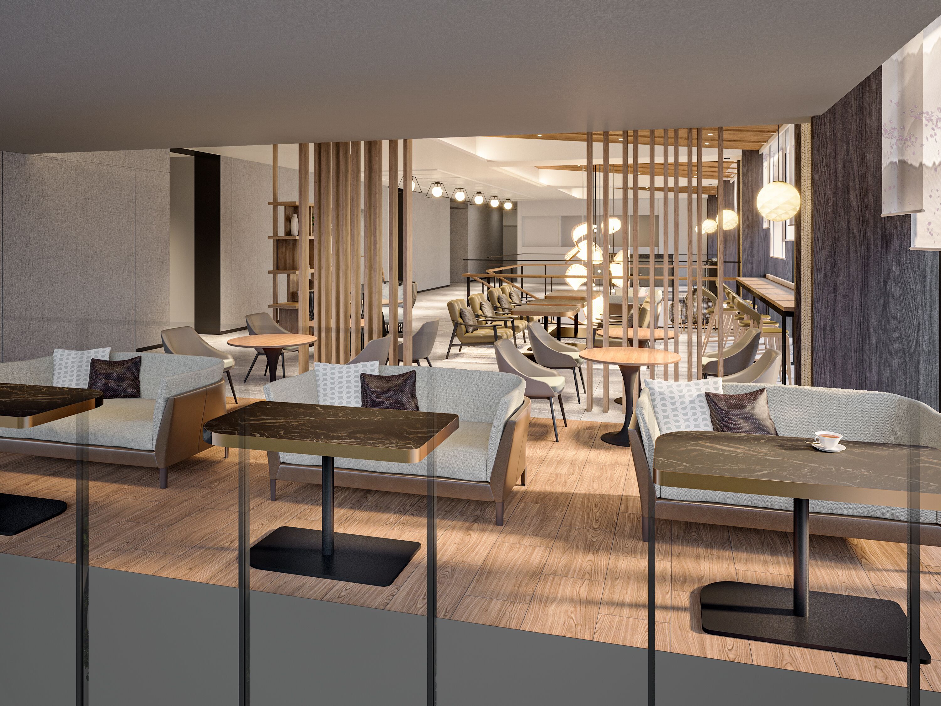 A modern interior with seating arrangements, tables, and a decorative wall.
