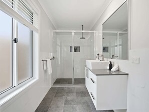 Shower, hair dryer, towels, shampoo - The Fairway - Refined Living & Private Guest Suite (Orange)
