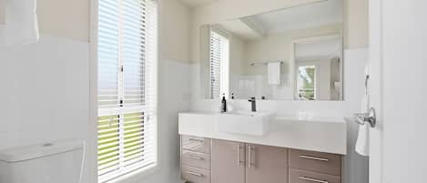 Shower, hair dryer, towels, shampoo