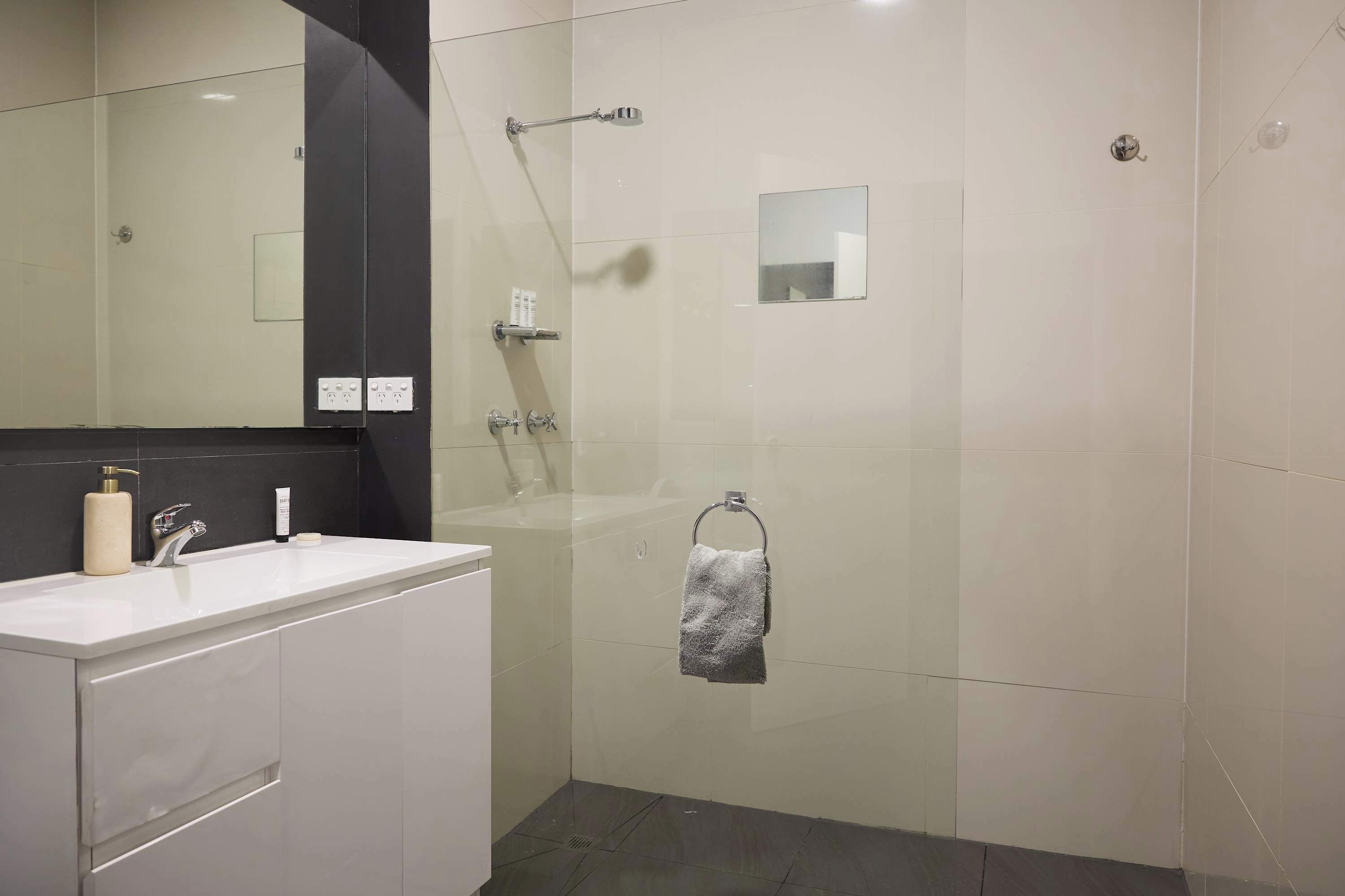 Shower, hair dryer, towels, shampoo