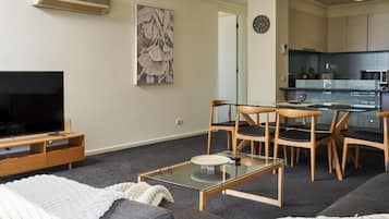 Deluxe Apartment, Balcony, City View | Living area | Smart TV