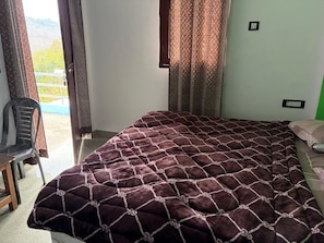 Habitación Deluxe | Camas extra y ropa de cama