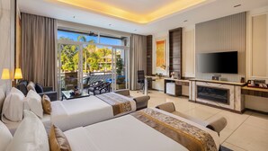 A hotel room with two beds, a TV, a desk, and a balcony with outdoor furniture. - Mountain Creek 7BHK Villa by ELIVAAS (Udaipur)