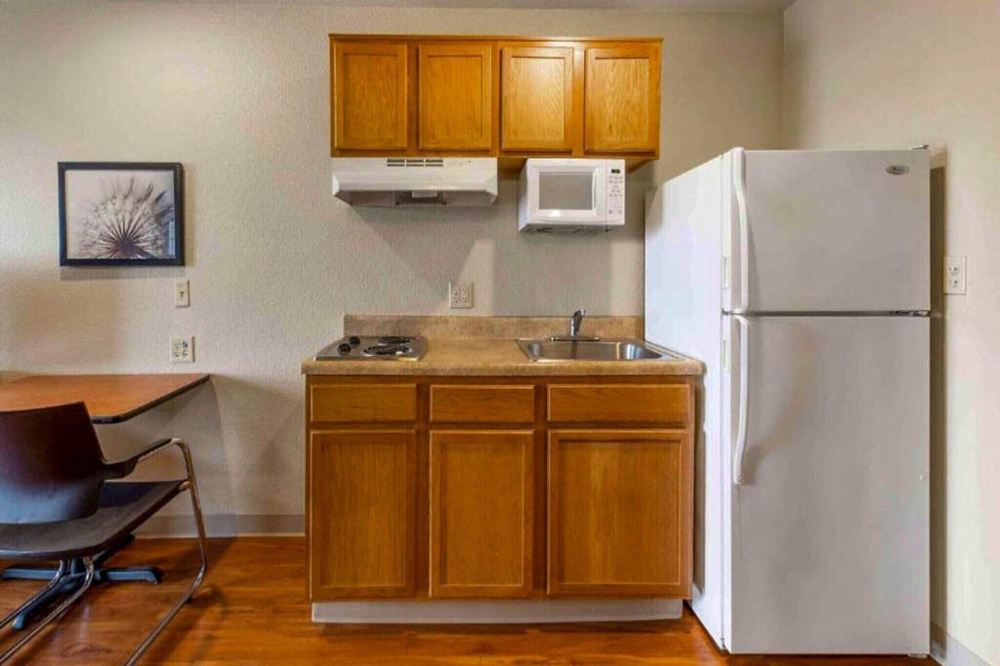 Fridge, microwave, stovetop, dining tables
