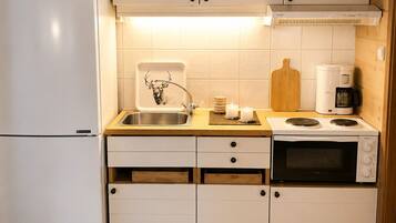 Fridge, oven, coffee/tea maker, cookware/dishes/utensils