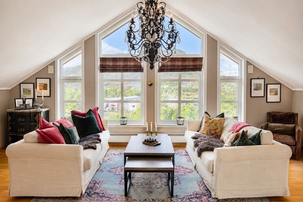 Spacious living and dining room with plenty of natural light and relaxation areas