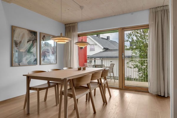 Dining area with entrance to the balcony.