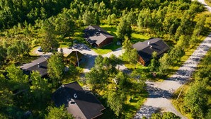 An aerial view of a residential area with multiple houses surrounded by dense forest. - Briskebu, cosy cabin by ski slopes (Hol)