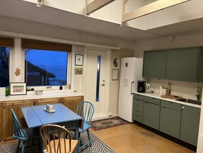 Fridge, coffee/tea maker, electric kettle, cookware/dishes/utensils