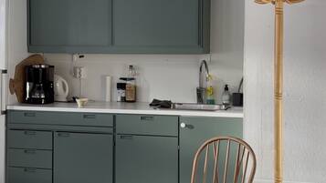 Fridge, coffee/tea maker, electric kettle, cookware/dishes/utensils