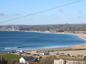 A coastal town with a beach, parked cars, and buildings. - Rosemount, Marazion, Cornwall (Marazion)
