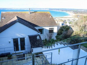 A white building with a tiled roof, a balcony, and a view of the sea. - Rosemount, Marazion, Cornwall (Marazion)