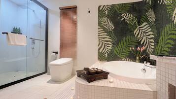 Family Suite, City View | Bathroom | Rainfall showerhead, hair dryer, slippers, towels