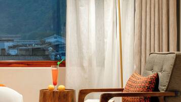 Premium bedding, blackout curtains, soundproofing, iron/ironing board
