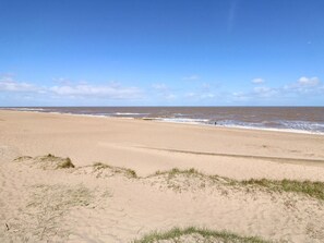 A beach with sand dunes and the ocean. - 3 Cherry Blossom, Chapel St Leonards (Skegness)