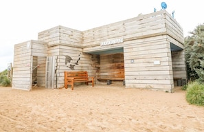 A wooden building with a sign reading 'CLOUD BAR' on the front. - Windyridge, Chapel St Leonards (Skegness)
