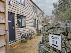 A wooden building with a sign indicating 'HOLIDAY LETS' pointing to the right. - Bangor in Overton nr Ellesmere (Wrexham)