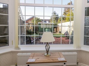 A room with a large window, a table with a lamp, and a radiator. - Southpoint, Bridlington (Bridlington)