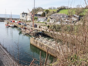 A harbor with boats, a lock, and houses in the background. - 13 Clock Tower Court, Charlestown (St. Austell)