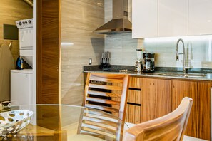 Fridge, microwave, oven, stovetop - Sleek 9th-floor condo with wraparound balcony, ocean views & pool (Puerto Vallarta)