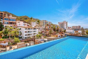A heated pool - 2nd-floor condo with heated outdoor pool, grills, balcony, W/D, AC (Puerto Vallarta)