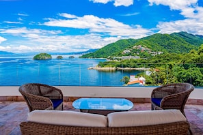 Terrace/patio - Luxe 8th-floor condo with endless ocean views, pool, spa & balcony (Puerto Vallarta)