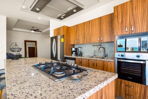 Fridge, microwave, oven, stovetop - 5th-floor condo with partial ocean views, heated pool, sauna, gym, balcony, W/D (Puerto Vallarta)
