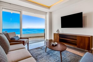 TV - Oceanfront condo with rooftop infinity pool, panoramic views, balcony, gym, & AC (Puerto Vallarta)