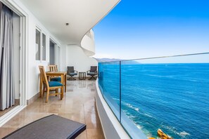 Outdoor dining - Oceanfront condo with rooftop infinity pool, panoramic views, balcony, gym, & AC (Puerto Vallarta)