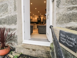 A stone building entrance with a sign reading 'Brynt Tawel Arthur Terrace.' - Bryn Tawel in Penmachno, Conwy (Betws-y-Coed)