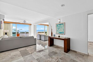 Living area - Stylish oceanview suite with infinity pool, full kitchen & bay-view terrace (Puerto Vallarta)