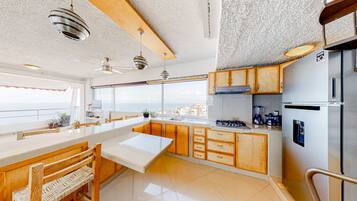 Fridge, microwave, stovetop, coffee/tea maker
