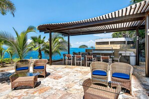Outdoor dining - Modern condo with ocean views, rooftop infinity pool & central AC (Puerto Vallarta)