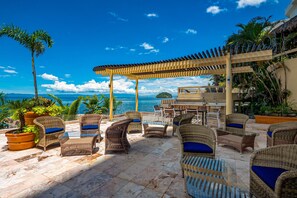 Outdoor dining - Upscale oceanfront condo with extensive balcony, pool & ocean views (Puerto Vallarta)