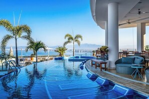 A heated pool - Modern hillside suite with balcony, city view, pools, gym & full kitchen (Puerto Vallarta)