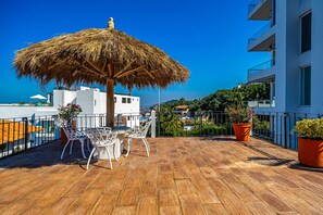 Outdoor dining - Charming condo featuring ocean views, pool & private terrace (Puerto Vallarta)