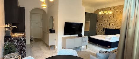 Apartment, 1 Queen Bed with Sofa bed, City View | Living area | 50-inch Smart TV with cable channels