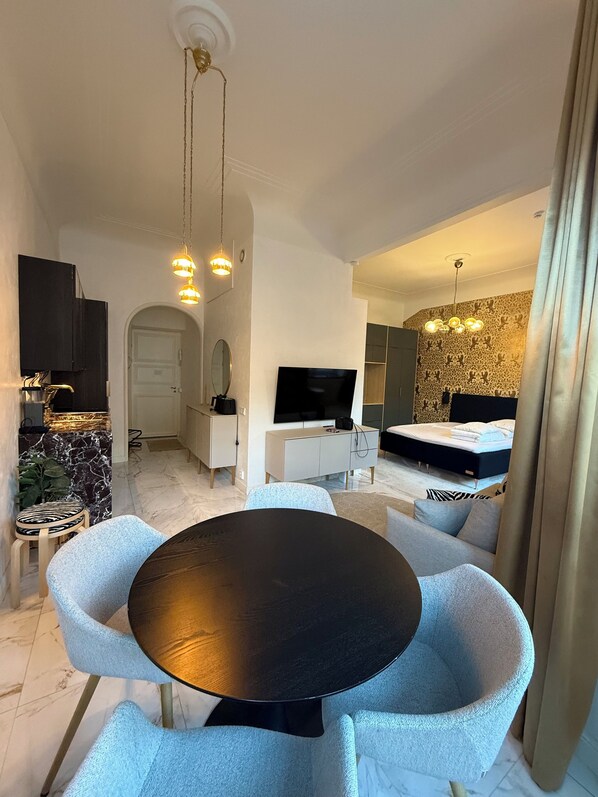 Apartment, 1 Queen Bed with Sofa bed, City View | Living area | 50-inch Smart TV with cable channels