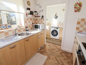 Dishwasher, high chair - Coastal Retreat, in Seahouses. (Seahouses)