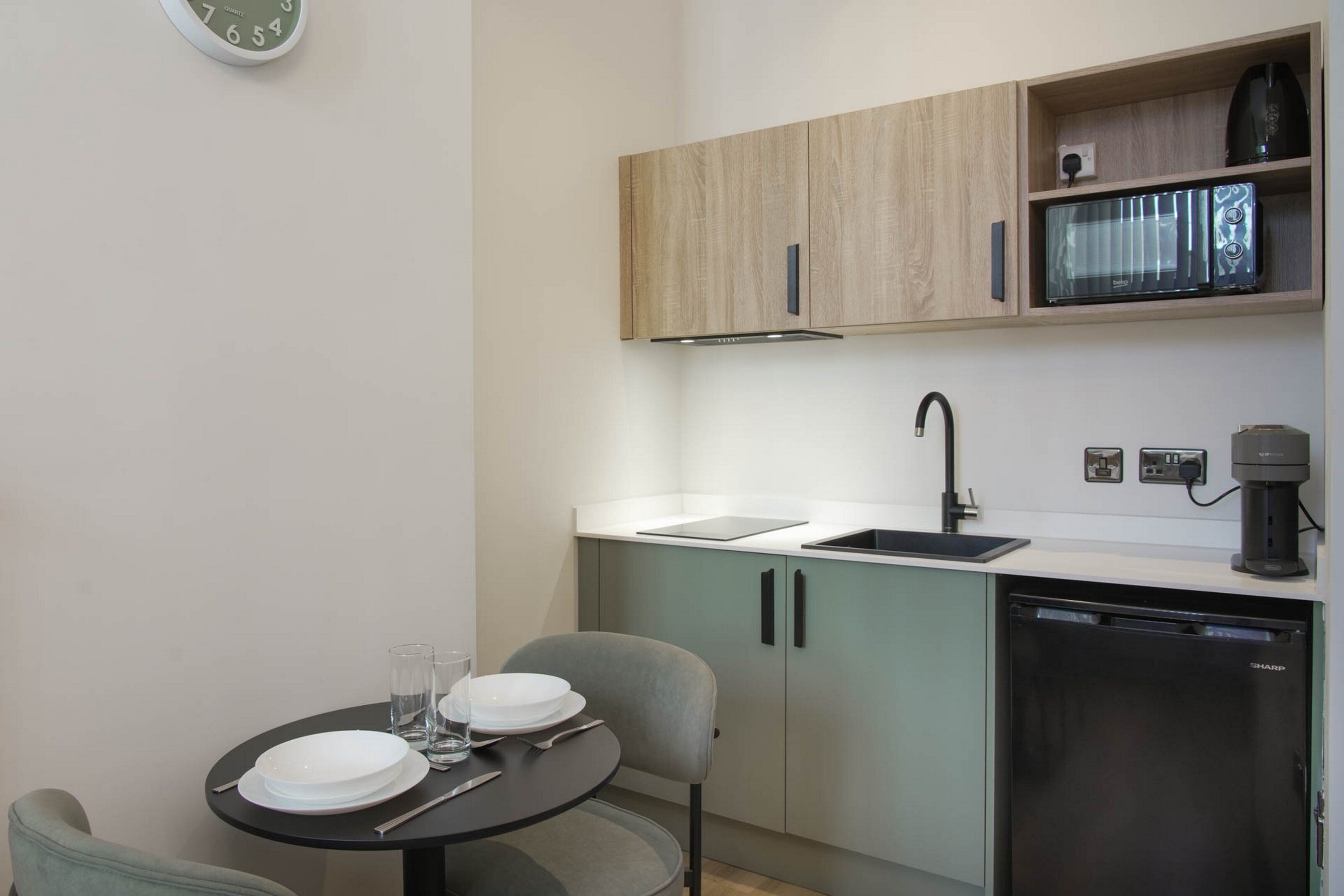 Fridge, microwave, stovetop, coffee/tea maker