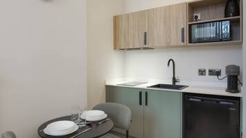Fridge, microwave, stovetop, coffee/tea maker