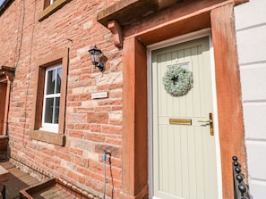 A brick building with a light green door, a window with a white frame, and a sign reading 'EDENVIEW'. - 3 Eden View, Lazonby (Penrith)