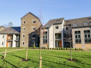 A modern building with a stone facade, large windows, and a flat roof. - Brimstone, Backbarrow, Cumrbia (Ulverston)
