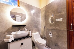 A modern bathroom with a sink, toilet, and shower. - ELIVAAS The Nakshatra Serene 3BHK Villa (Sukha)