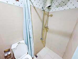 Shower, bidet, towels, soap - Budget Staycation MOA | WiFi Smart TV (Pasay City)