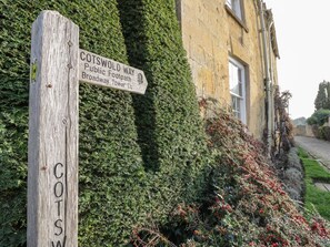 A wooden signpost with directions to Cotswold Way and Broadway Tower. - Chapel Cottage, near Pershore. (Pershore)