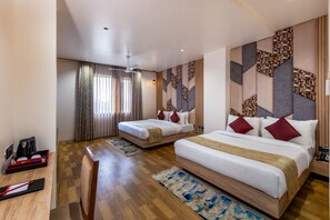A hotel room with two beds, a desk, a coffee machine, and a view of the outdoors. - Lords Inn Sangam, Bhopal (Bhopal)